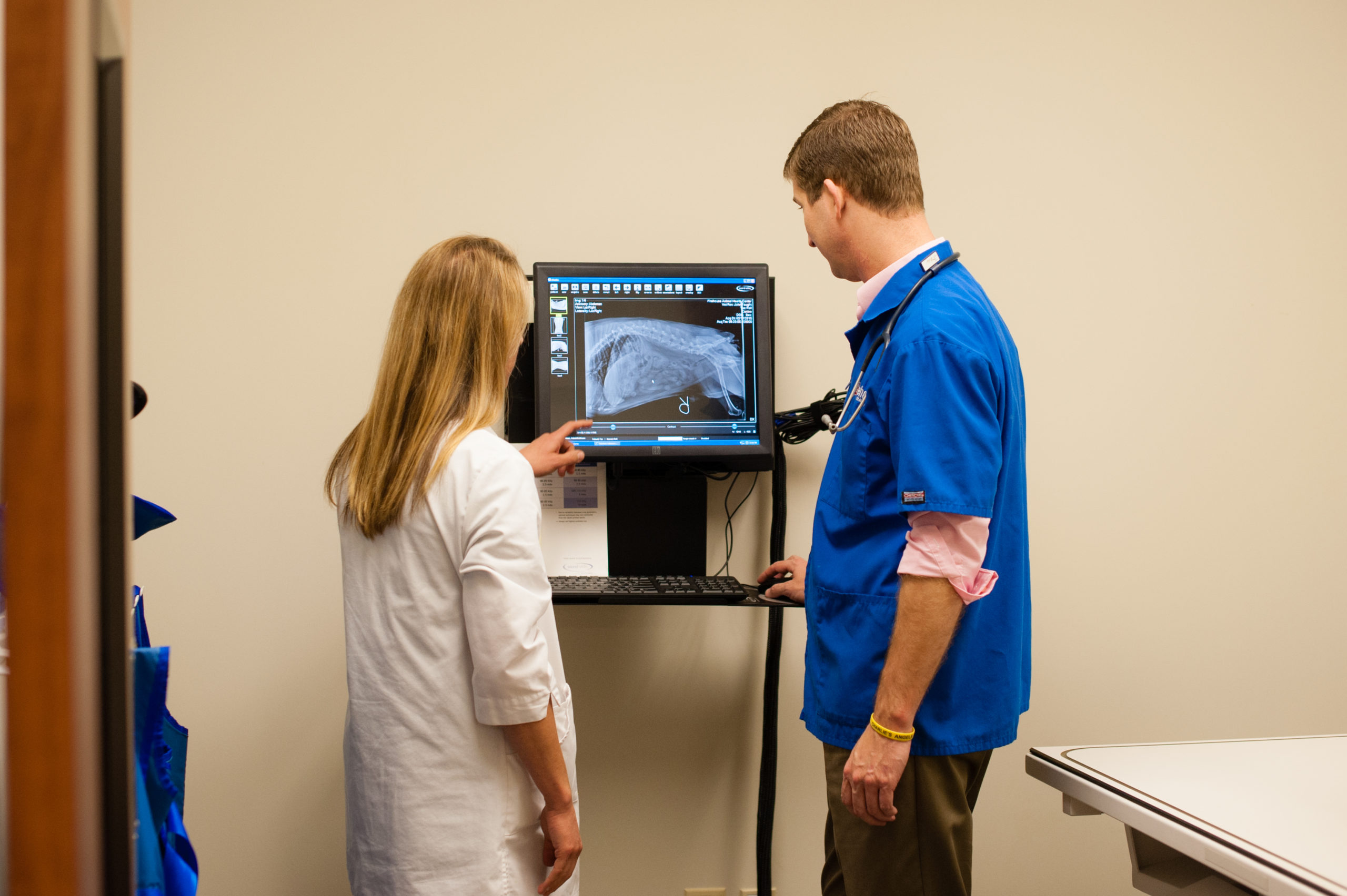 Dr Stacy Mozisek and Dr John Faught review an x-ray