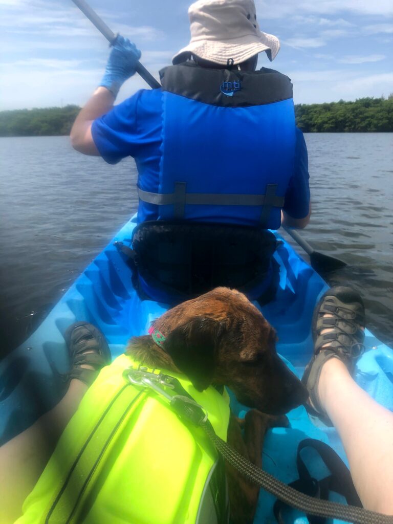 Alisha with dog, Nestle, on the lake in kayak